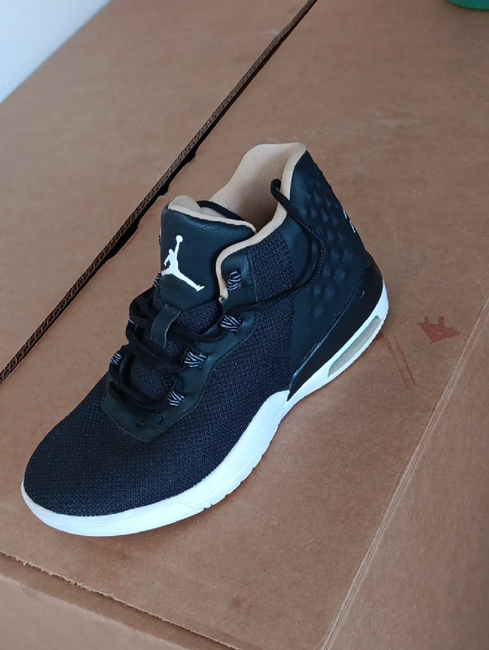 Jordan Black and White Mid-Top Sneaker with Cream Lining